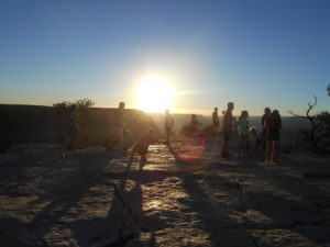 Group of people gathered to watch the sunset